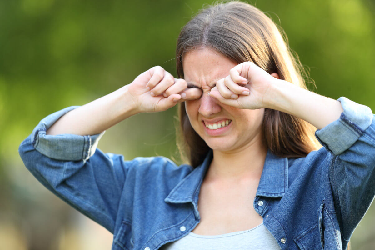 Woman suffering with dry eyes