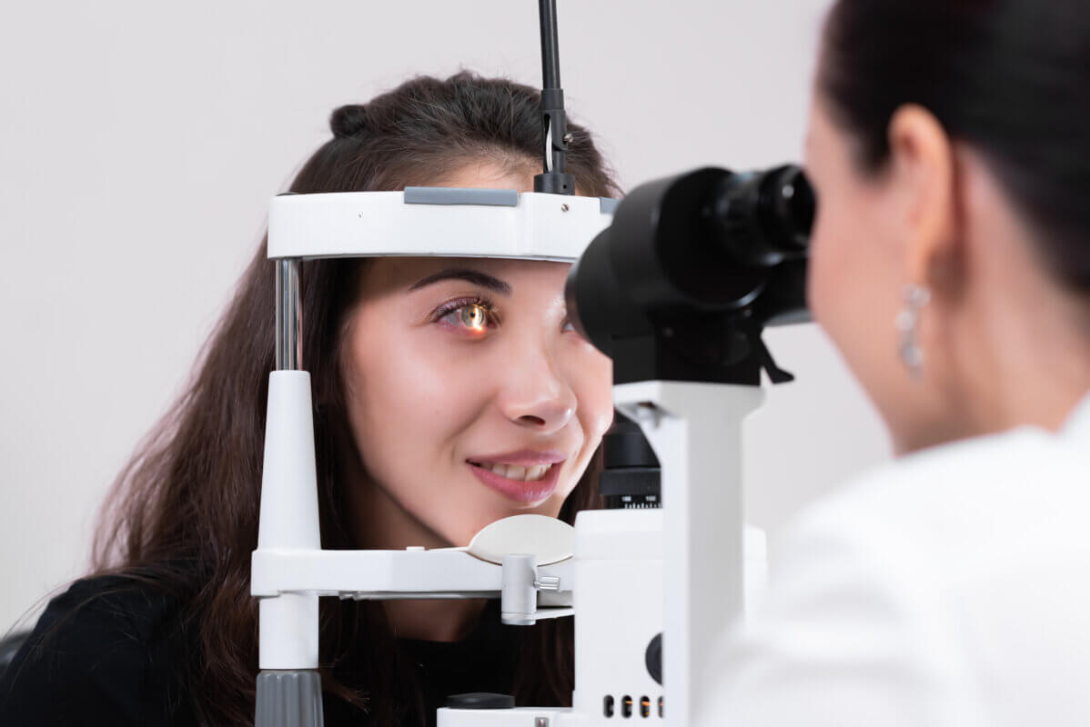 Woman on slit lamp during eye exam